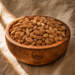 مغز بادام خام روستاژ در کاسه چوبی