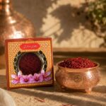 زعفران سرگل ممتاز قائنات در کنار کاسه مسی سنتی